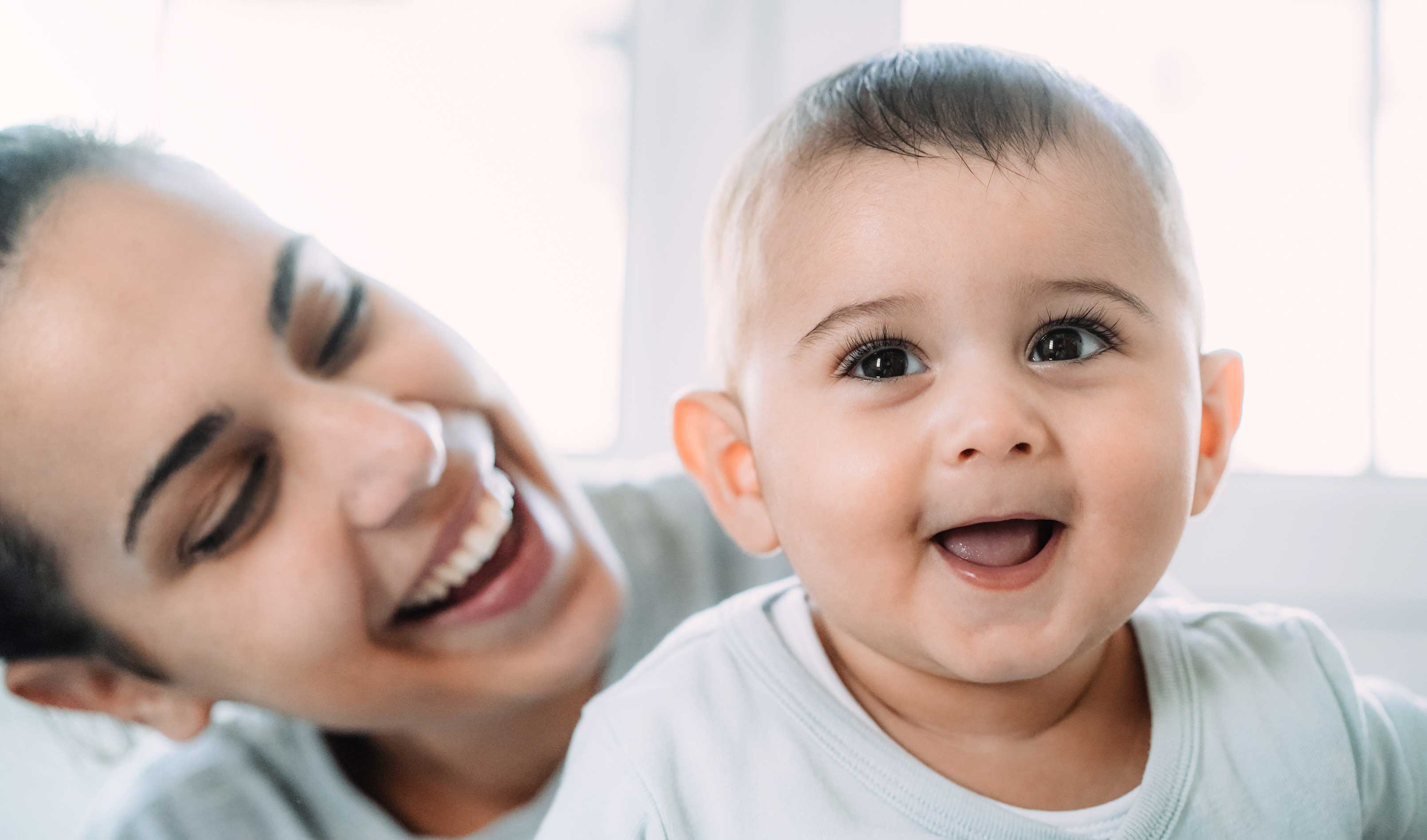 young-boy-having-fun-with-her-mother-at-home-foc-2022-01-10-22-38-52-utc.jpg